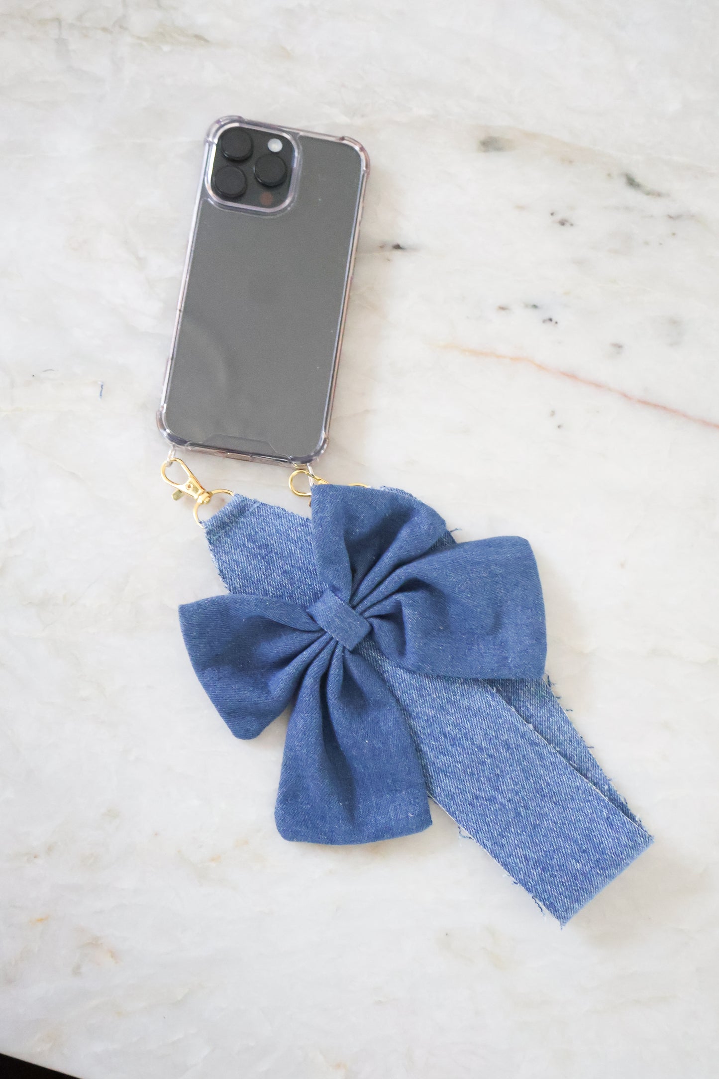 Phonecord denim bow